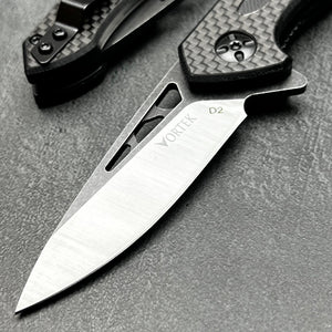 CINDER:  Carbon Fiber Handles,  D2 Drop Point Blade,  Ball Bearing Flipper System