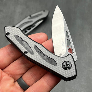 CINDER:  Carbon Fiber Handles,  D2 Drop Point Blade,  Ball Bearing Flipper System