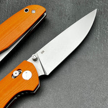 Load image into Gallery viewer, FOCAL: Orange G10 Handles, D2 Drop Point Blade, Axis lock Safety System, EDC Large Folding Pocket Knife