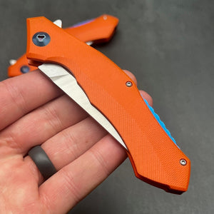 SCIMITAR:  Orange G10 Handles, D2 Trailing Point Blade,  Ball Bearing Flipper System, EDC Folding Pocket Knife