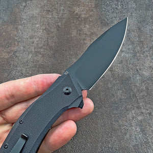 GROWLER: Black Oxide D2 Drop Point Blade, Black G10 Handles, Ball Bearing Flipper System