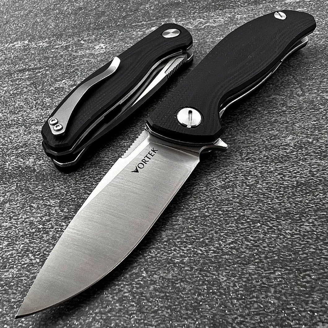 TURRET:  Black G10 Handles, D2 Drop Point Blade,  Ball Bearing Flipper System