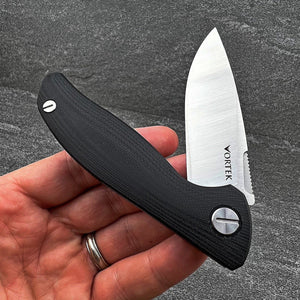 TURRET:  Black G10 Handles, D2 Drop Point Blade,  Ball Bearing Flipper System