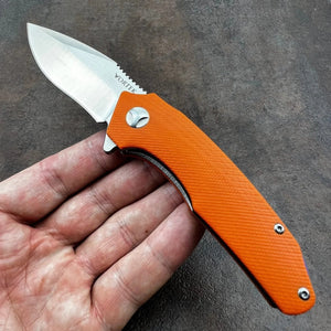 MUSKRAT:  Orange G10 Handles, 9Cr18MoV Drop Point Blade,  Ball Bearing Flipper System