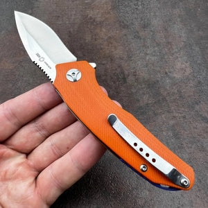 MUSKRAT:  Orange G10 Handles, 9Cr18MoV Drop Point Blade,  Ball Bearing Flipper System