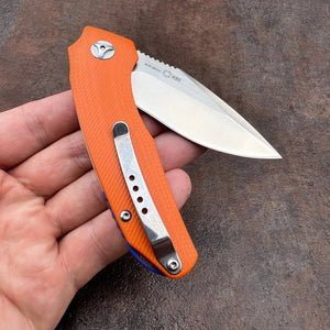 MUSKRAT:  Orange G10 Handles, 9Cr18MoV Drop Point Blade,  Ball Bearing Flipper System