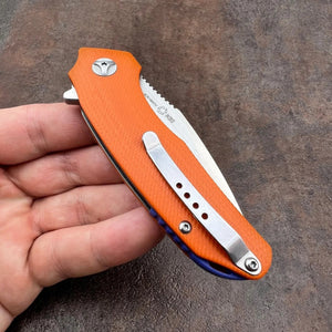 MUSKRAT:  Orange G10 Handles, 9Cr18MoV Drop Point Blade,  Ball Bearing Flipper System