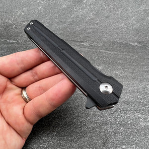 NOVA: Tactical Black G10 Handle, D2 Slim Design Black Blade,  Ball Bearing Flipper System