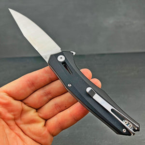 SCURRY:  D2 Drop Point Blade, Black G10 Handles,  Ball Bearing Flipper Pivot System