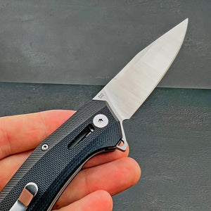 SCURRY:  D2 Drop Point Blade, Black G10 Handles,  Ball Bearing Flipper Pivot System