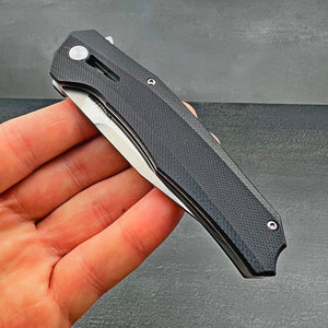 SCURRY:  D2 Drop Point Blade, Black G10 Handles,  Ball Bearing Flipper Pivot System