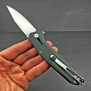 SCURRY:  D2 Drop Point Blade,  Green G10 Handles,  Ball Bearing Flipper System