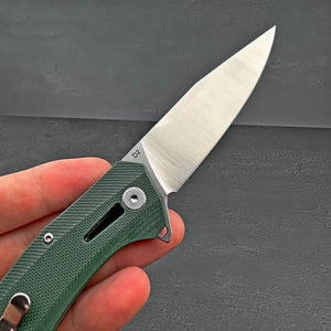 SCURRY:  D2 Drop Point Blade,  Green G10 Handles,  Ball Bearing Flipper System