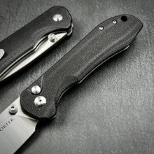 Load image into Gallery viewer, BORIS: Black Micarta Handles, Button Safety Lock, Ball Bearing Pivot System, D2 Drop Point Blade