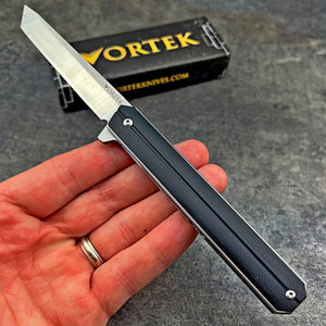 SKYLINE: Black G10 Handles, Slim Executive Design, Ball Bearing Flipper System, D2 Tanto Blade